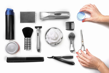 Female hands, black photo, shaving set with equipment, tools and foam, isolated on white