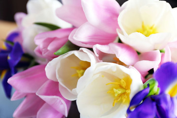 Bouquet of white, pink tulips and purple iris, close up