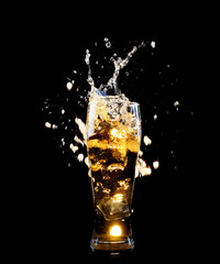 Big glass of fresh beer on dark background