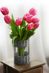 Bouquet of pink tulips in a vase, close up