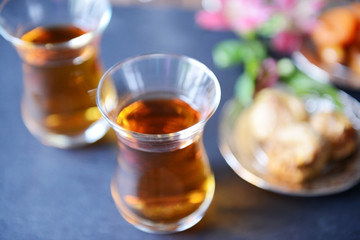 Glasses of tea on blue table closeup