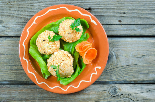Decorated hoopla salad on a clay plate