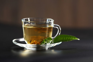 Cup of green tea on dark background