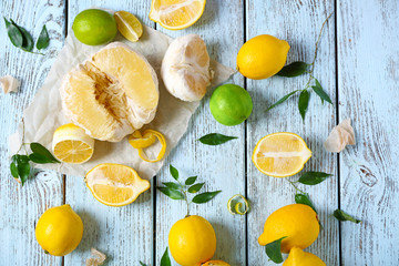 Various citrus fruits on wooden table