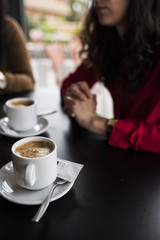Cup of coffee on table in cafe