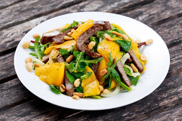 Fresh Tasty Mango, beef salad with vegetables and nuts.