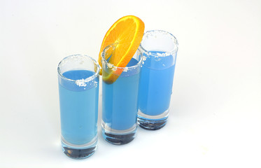 Beautiful row line of different colored alcohol cocktails
