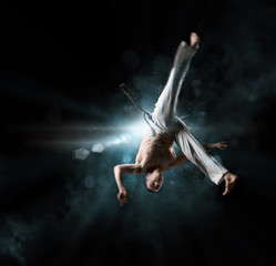 male fighter trains capoeira