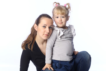 .mother and small daughter looking at the viewer