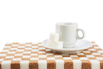 Empty coffee cup on a saucer with three cubes of sugar on a stan