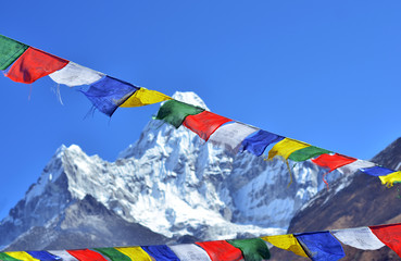 Colorful prayer flags and  Ama Dablam, Everest region, Nepal 