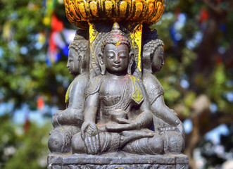 Buddha statue   on the square near Swayambhunath stupa in Kathmandu valley, Nepal 
