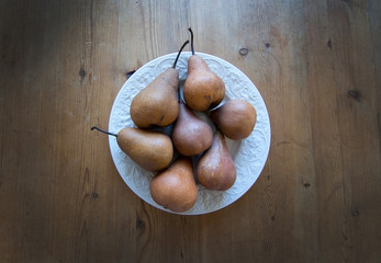 Pears on white plate