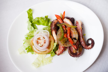Grilled octopus with salad