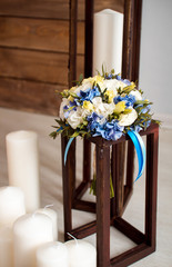 wedding bouquet with white and blue flowers with white candles