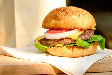 Yummy Beef and cheese Hamburger place on wood tray