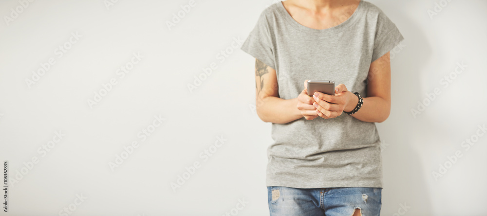 Poster beautiful hipster woman checking email via mobile phone while background with copy space for text me