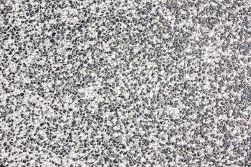 Gray rough grainy granite wall bacgkround.