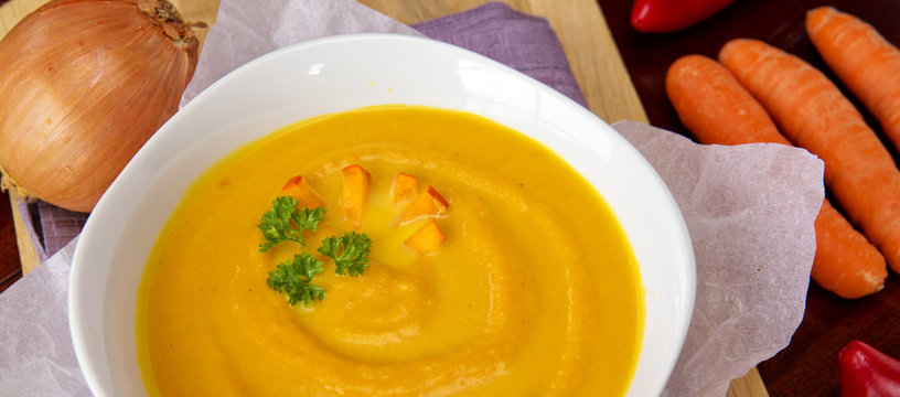 Fresh pumpkin soup with  vegetables .