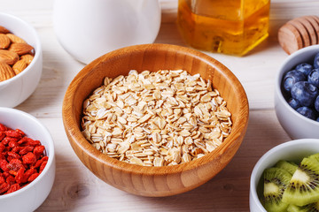 Healthy breakfast - bowl of oat flakes with fresh fruit, almond