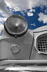 Detail of a vintage car light in colours