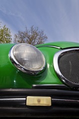 Fototapeta na wymiar Detail of a vintage car light in colours