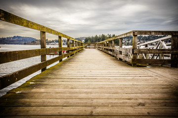Gritty wooden pier on a cloudy day