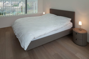 Fototapeta na wymiar Interior, bedroom with parquet floor