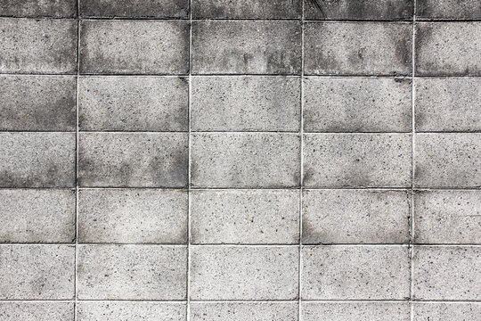 Grunge gray dirty brick wall background.