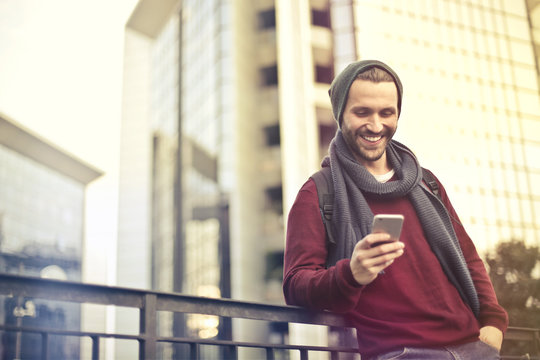 Happy Man Checking His Phone