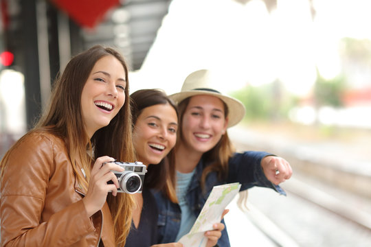 Group of traveler girls traveling in a train station