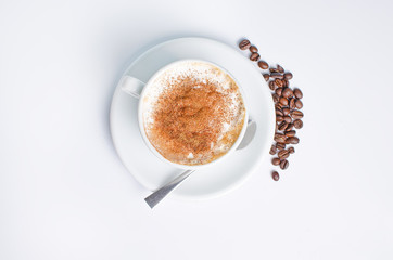Hot coffee with beans on BELM BACKGROUND WITH SPOON