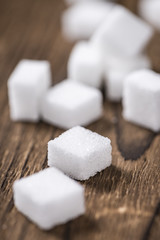 Old wooden table with white Sugar