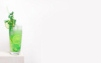 fruit cold lemonade on a stone table with lime