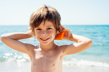 boy plays with solar protection