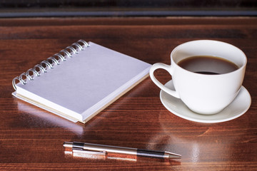 Coffee, notepad and pen