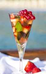 Fruit punch in glass by the seaside