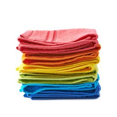 Pile of rainbow colored towels isolated