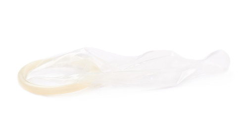 Unrolled latex condom isolated