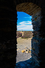 Trig point seen through arch, Parys Mountain.