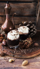 hot chocolate in glass cups and cream with nuts