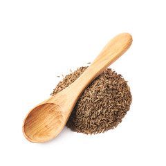 Wooden spoon over the pile of cumin