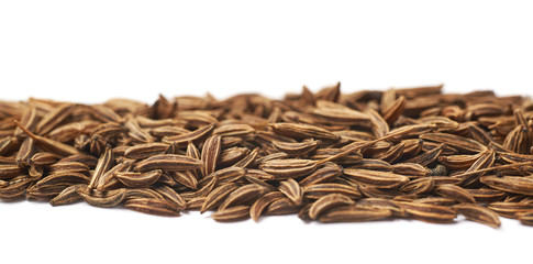 Line of cumin seeds isolated