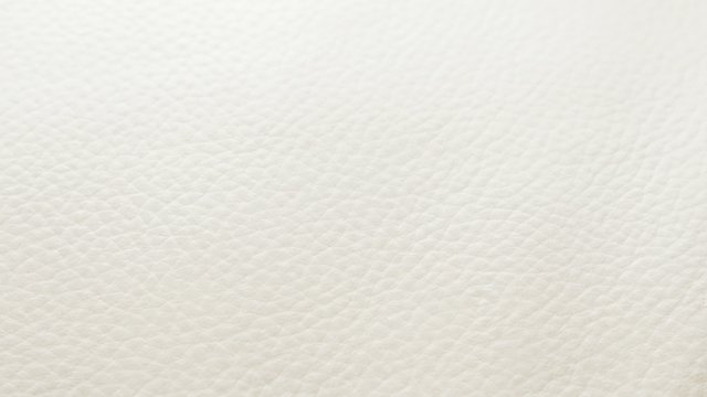 Shallow DOF white leather sofa texture slow tilting 4K 2160p 30fps UHD video - Leather beige sofa rough texture close-up 4K 3840X2160 30fps UltraHD tilt footage