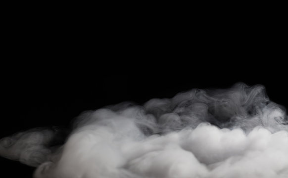 Smoke fragments on a black background with copy space