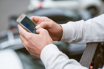 Modern man holding cell phone