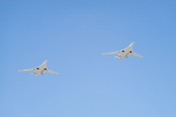 Tupolev Tu-160 (Blackjack) supersonic variable-sweep wing heavy strategic bomber fly on blue sky background 