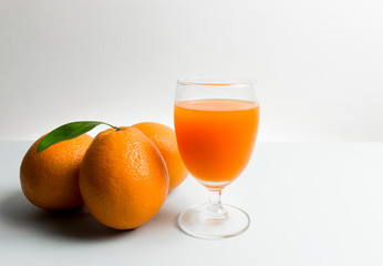 Orange and orange juice with white background