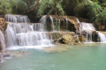 Fototapeta na wymiar The Kuang Si Falls or known as Tat Kuang Si Waterfalls, is a three tier waterfall about 29 kilometres south of Luang Prabang ,Laos 