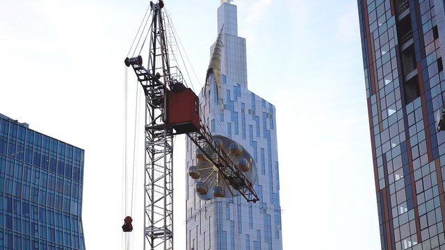 Establishing shot. Scyscrape constraction at sunset